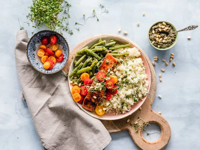 Bowl of garden vegetables served on a wooden board